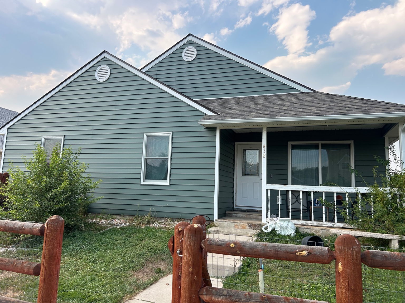 House after completed siding installation